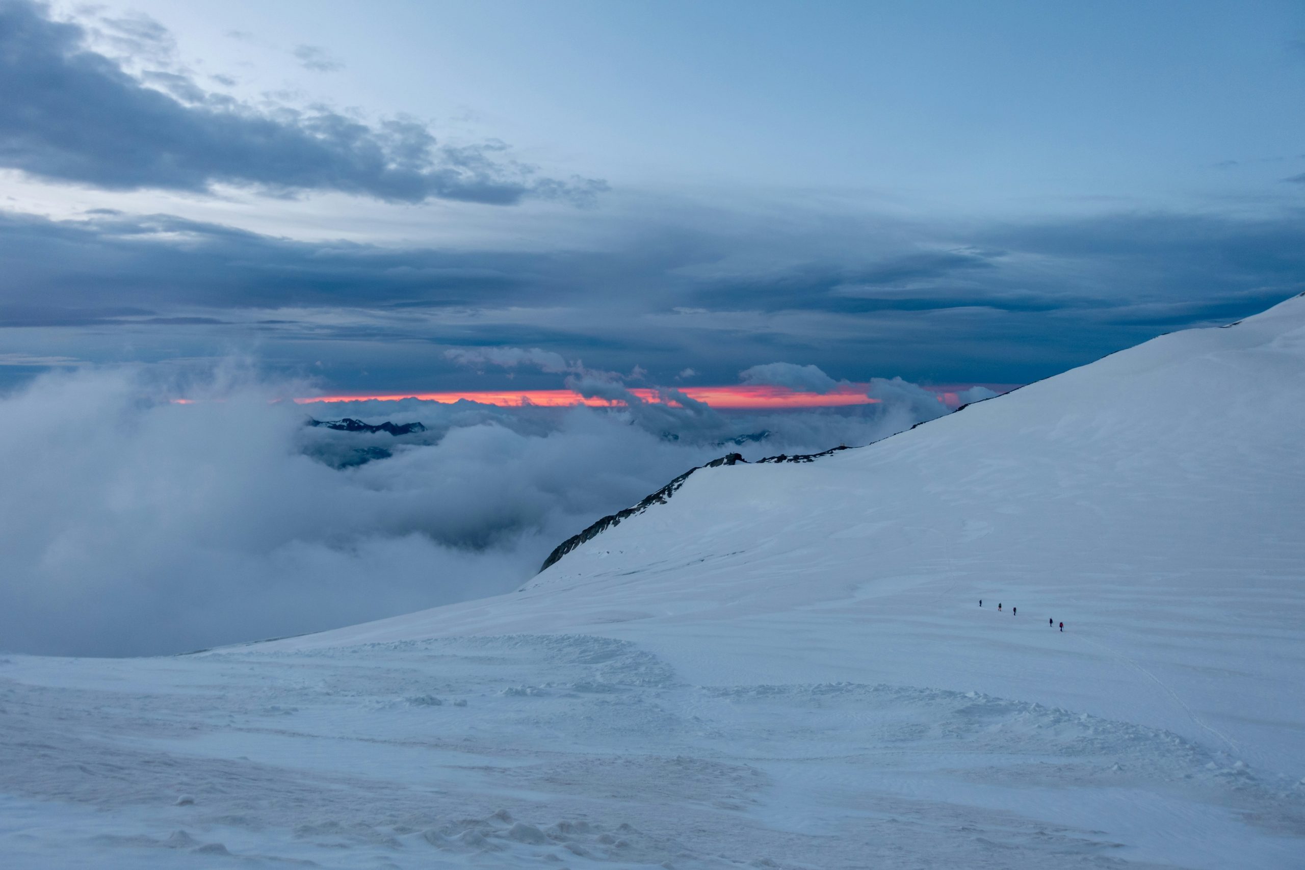 A breathtaking sunrise over snow-capped mountains captured using professional hiking camera gear.