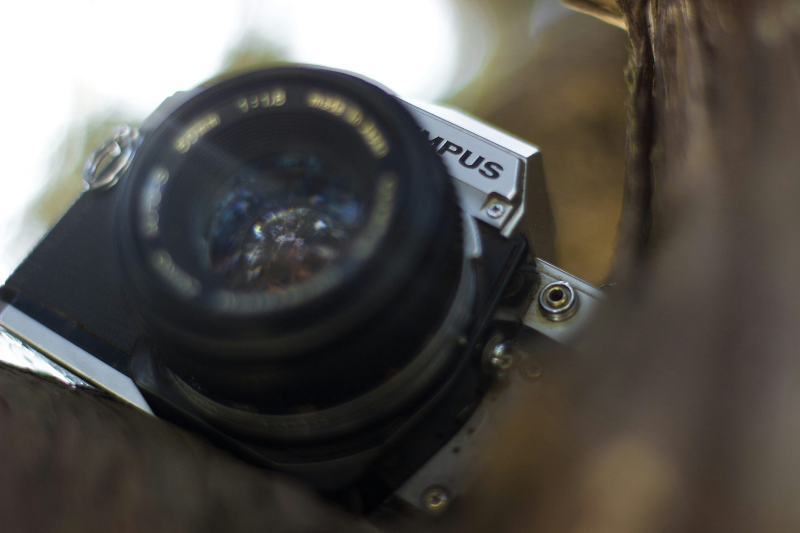 hiker adjusting trail camera