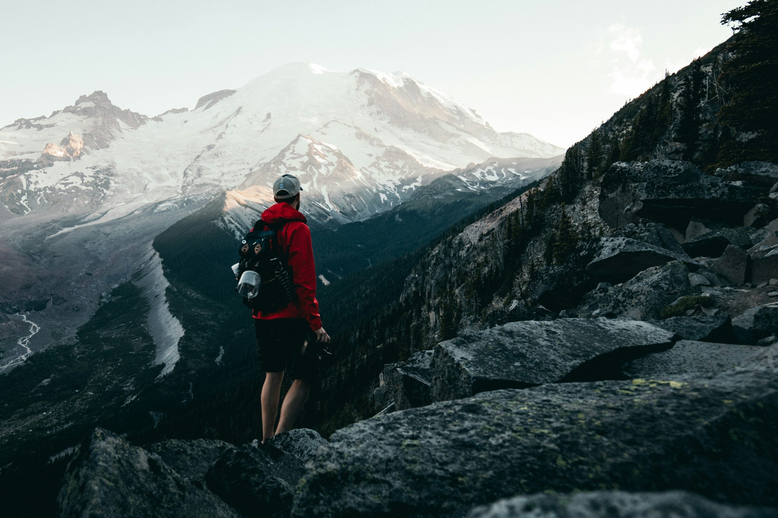 hiker with camera on mountain trail