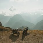 hiker with camera on mountain trail