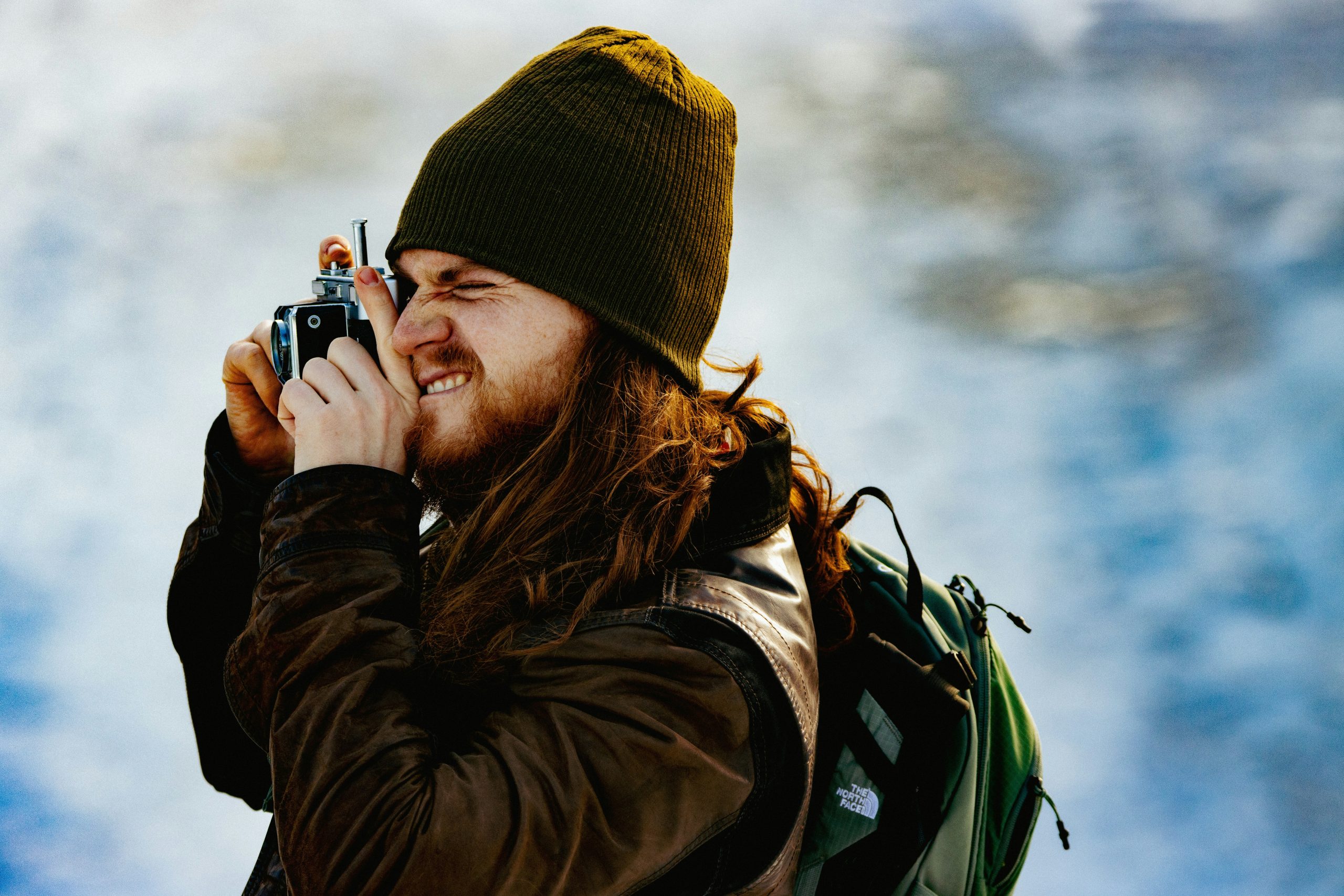 Hiking camera capturing a scenic mountain trail view